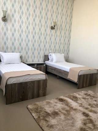 Отель Tarlan Hotel Актау Бюджетный двухместный номер с 2 отдельными кроватями-2